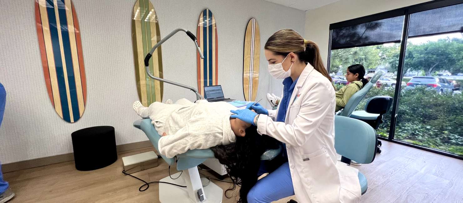 Dr. Brothers working on a patient